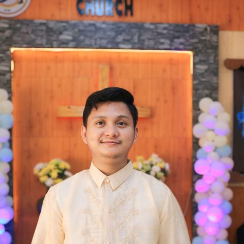 Melquizedek Felix wearing a cream Barong Tagalog